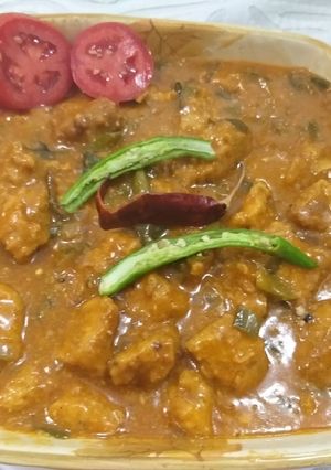 A picture of Chicken 65 with gravy.