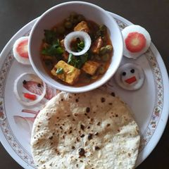 A picture of Matar Paneer and Tandoori Roti.