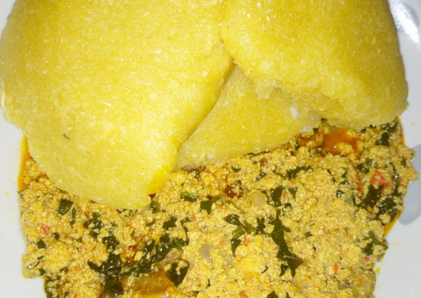 Egusi soup with yellow eba