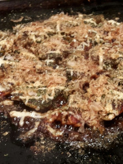 A picture of Okonomiyaki Japanese savory pancake.