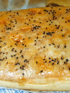Una foto de Empanada de atún, huevo y tomate