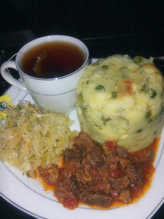 A picture of Simple peas mukimo with beef stew and black tea.