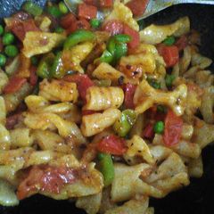 A picture of Homemade macaroni/ pasta with vegetable tadka.