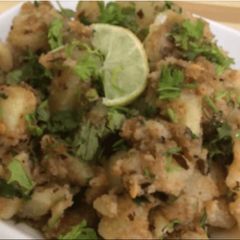 A picture of Fried potatoes with water chestnut flour (Singhara aata).