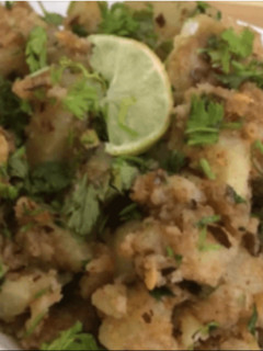 A picture of Fried potatoes with water chestnut flour (Singhara aata).