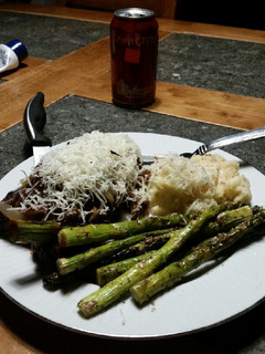 A picture of Brad's red wine NY steaks with grilled asparagus.
