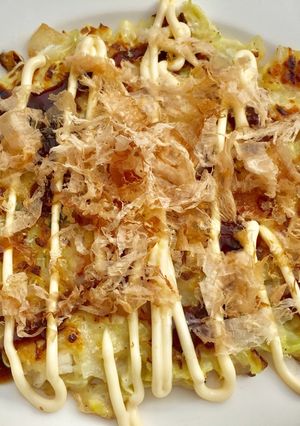 A picture of 66 • Okonomiyaki or "Japanese Pizza" 🇯🇵.