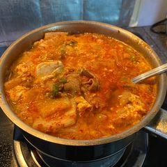 A picture of Kimchi Tofu Stew (순두부찌개).