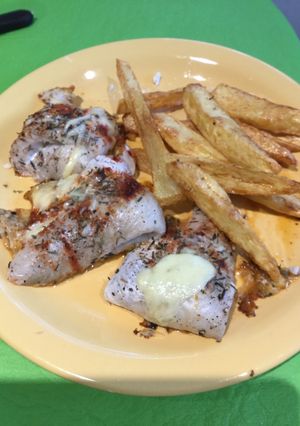 Una foto de Filetes de merluza con quesos y especias al horno