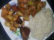 A picture of roast chicken with carrots