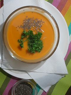A picture of Butternut soup with chia seeds toppings.