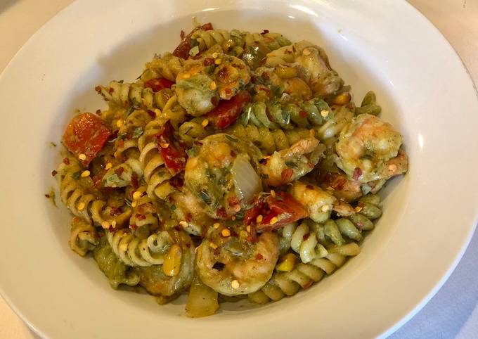 Penne Pasta with Shrimps, fire roasted red peppers, sautéed onions, corn in Avacado Lime Pesto Sauce