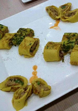 A picture of Tuna stuffed crépes.