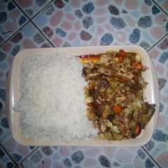 A picture of Rice with cat fish source.