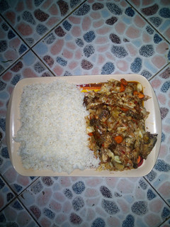 A picture of Rice with cat fish source.