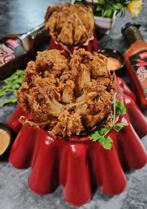 A picture of Blooming Onion with Dipping Sauce.