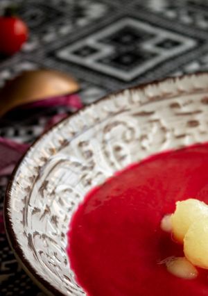 A picture of Beet Gazpacho with Melon Pearls.