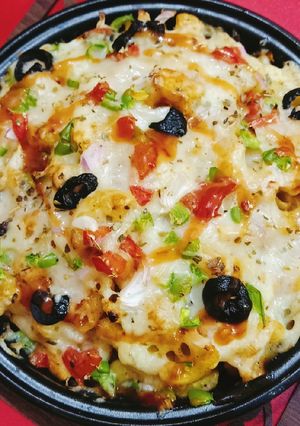 A picture of Cheesy Pizza Tikka Fries 🍟 🍟.