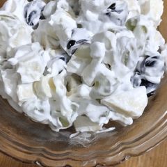 A picture of Fresh fruit and cream.