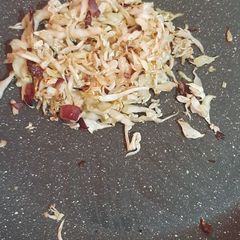 A picture of Cabbage with onions.