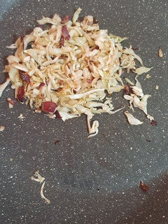 A picture of Cabbage with onions.