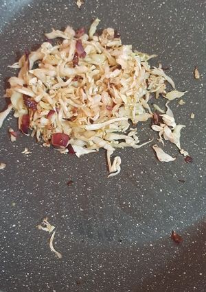 A picture of Cabbage with onions.