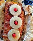 Rollo de carne hawaiano con tocino y salsa BBQ