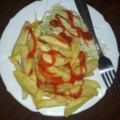 A picture of Healthy fries and raw salad.