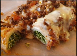 Una foto de Canelones de acelga y Ricota Con tuco de carne molida/picada 👌