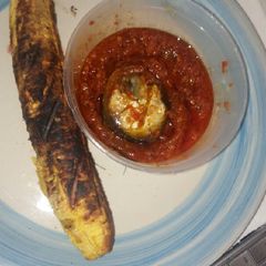 A picture of Grilled plantain with home made pepper sauce.