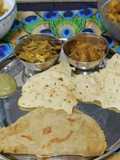 Rajasthani Thali Ker Sangri Sabji Jodhpuri Aloo with Dal Paratha Chutney and Papad (Lunch Thali)