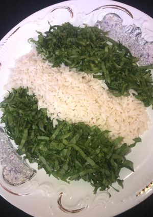A picture of White rice with salad.