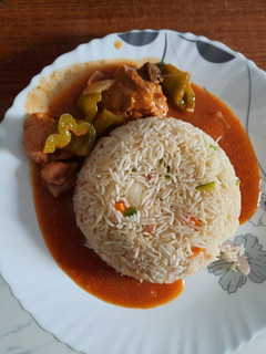 A picture of Chicken Jalfrezi with Egg Fried Rice.
