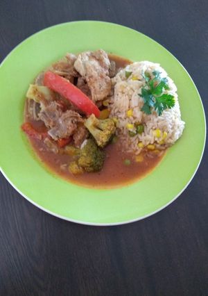 A picture of Pork Chops with Peppers and Broccoli in Tomato Sauce.