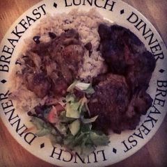 A picture of Brown stewed chicken with rice & ps.