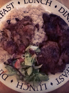 A picture of Brown stewed chicken with rice & ps.