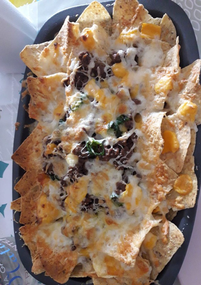 Una foto de Nachos con carne y queso