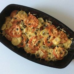 A picture of Potato Gratin with Tomatoes, Cheese and Capers.