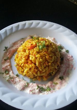 A picture of Carrot sushila(carrot kurmure pohe) with carrot koshimbir.