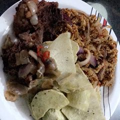 A picture of Fried yam,chicken and egg sauce.