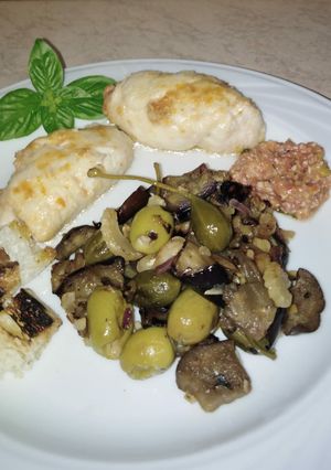 A picture of Trinacria Chicken Rolls with Caponata and Caper Berries.