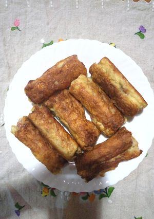 A picture of Bread, sausage, eggs toast.