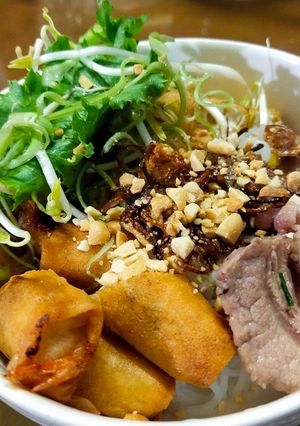 A picture of Vermicelli with Stir-Fried Pork and Seafood Egg Rolls.
