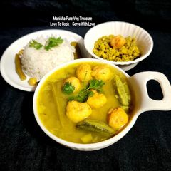 A picture of Moong Kadhi With Urad Dal pakore and Mix Veggies.