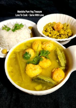 A picture of Moong Kadhi With Urad Dal pakore and Mix Veggies.