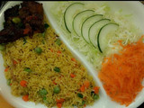 Fried rice garnished with peppered beef