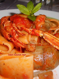 Foto di Calamarata con Scampi, Pomodorini e Carciofi
