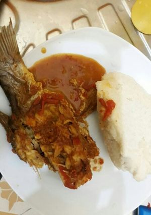 A picture of Fish curry served with Ugali.