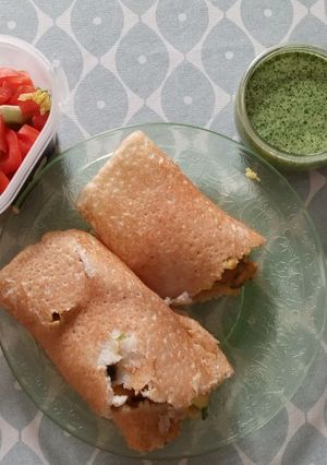 A picture of Spicy Potato-filled Dosa with Green Chilli Chutney.