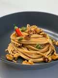 Spaghetti with Garlic, Olive Oil, Red Pepper Flakes, Walnuts, and a Touch of Pesto
